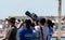 Photographers pointing zoom lenses to sky at Clacton free airshow