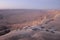Photographers view the sunset from the Ramon Crater top to inside it