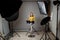 Photographing children in professional photo studio with lighting equipment