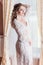 Photographing morning of the bride. Bride in a negligee