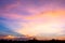 Photographs of the sky after the sunset, with colorful and shaded grasslands in the community crossing the horizon