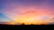 Photographs of the sky after the sunset, with colorful and shaded grasslands in the community crossing the horizon