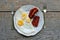 Photography of Breakfast made of fried eggs and bacon