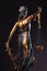 Photography of bronze themis sculpture, femida or justice goddess on dark background