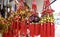 a photography of a bunch of red and gold ornaments hanging from a ceiling, a close up of a bunch of red and gold ornaments