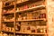 Photography with canned jars in the basement of the house, jars of different shapes on wooden shelves, various canned food, autumn