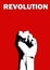 Photography of male fist rising up isolated on red  background with word revolution above it