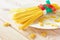 Photography of measuring tape wrapped around spaghetti on white plate. Dieting concept image