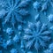 Photography of realistic frost flowers and icicles on a clear blue and silver background. AI-Generated.