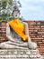a photography of a statue of a person sitting in a meditation position, there is a statue of a buddha sitting on a stone platform