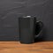 Photorealistic Black Mug Mockup With Meach Mcks Logo