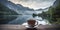 Photorealistic composition of a mug with a drink against the backdrop of a lake and mountains.