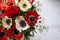 Photos of a bouquet of red and white flowers anemone and roses