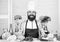 Photos of food. Vegetarian. Mature chef with beard. Bearded man cook in kitchen, culinary. Chef man in hat. Secret taste
