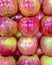 Photos of juicy red apples laid out on the counter.