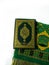 Photos of the Koran and prayer rugs ready for Ramadan.  Arabic on the cover is translated as the Qur'an