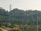 photos of several electricity poles, telephone towers and green mountain views