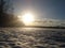 Photos with a winter backdrop in the rays of the setting sunlight of the countryside