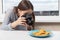Photoshop for beginners. Learn to take pictures correctly. Girl photographer takes nachos chips on a plate