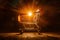 PhotoStock Glowing shopping cart illuminates against dark backdrop in captivating photo