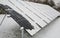 Photovoltaic panels covered with snow on a snowy day