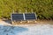 Photovoltaic panels on the wooden pallet in the home garden at winter time.