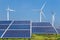 Photovoltaics solar panels and wind turbines generating electricity in solar power station
