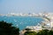 Phra Tamnak Mountain viewpoint many boat with many building surrounding the shore in Pattaya city, Thailand