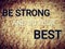 Phrase be strong and do your best on grunge rough rock stone background