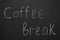 Phrase Coffee Break written with chalk on blackboard