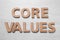 Phrase CORE VALUES made of wooden letters on white background, flat lay