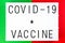 Phrase Covid-19 Vaccine written on a white banner with a colorful background