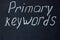 The phrase on the dark board `primary keywords`