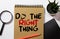 The phrase Do The Right Thing typed on a piece of paper and pinned to a cork notice board.