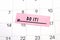 The phrase Do it written on a pink sticky note posted on a calendar or planner page. Deadline concept read a reminder on calendar