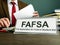 Phrase FAFSA Free Application for Federal Student Aid on the plate