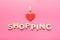 Phrase I love shopping on pink background with copy space