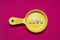 Phrase news from wooden letters on a plastic toy frying pan, red background. News preparation concept. The photo