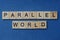Phrase parallel world in small square wooden letters