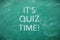 Phrase IT`S QUIZ TIME on dirty green chalkboard