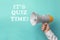 Phrase IT`S QUIZ TIME and man holding megaphone on turquoise background, closeup