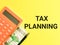 Phrase TAX PLANNING written on yellow background