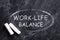 Phrase Work-life balance written on blackboard