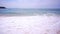 Phuket beach Crashing wave on beach sea sand and Clear blue sky in summer season.Sea waves seamless loop