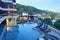 Phuket, Thailand - Apr 04 2017 : Hotel balcony and swimming pool with sunbeds at the yama hotel