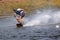 Phuket, Thailand, Cable Way Park, March 17, 2019, A young wakeboarder athlete glides on the surface of the water during a workout