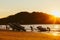 Phuket, Thailand - February 02, 2019: Mens at sunset pull jet ski out of the water on a sandy beach.  Summer vacation. Water bike