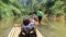 Phuket, Thailand - March 27, 2019. A group of tourists floats on the river. Girl 9 years old sailing on a raft on a