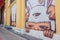 Phuket, Thailand - May 7, 2016: A mural artwork of an iconic character \'Mardi\', a kid in a bunny outfit by Alex Face