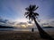 Phuket, Thailand. Tropical beach paradise with beach swing with women sitting. sunset with silhouette women relax on swing under